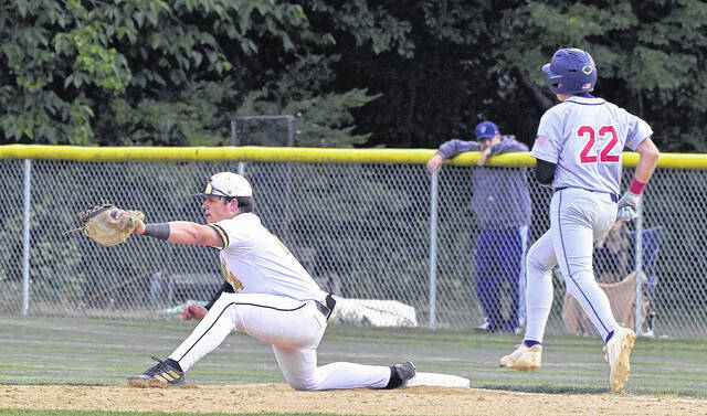Hobbtons Ben Neal seals the out at first base.