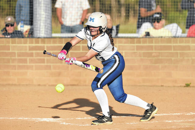 Midway junior Mollie Bass lays down a perfect bunt for a hit, advancing the base runners.