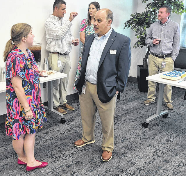 Katie Smith, left, speaks with Ron Carter during the event
