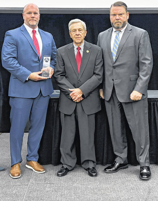 Most recently, Kevin Perry received the award for 2026 Investigator of the Year. From left, is Perry, now a captain at the Sampson County Sheriffs Office, along with Sampson Sheriff Jimmy Thornton and Ellis Boyle, United States Attorney for the Eastern District of North Carolina.