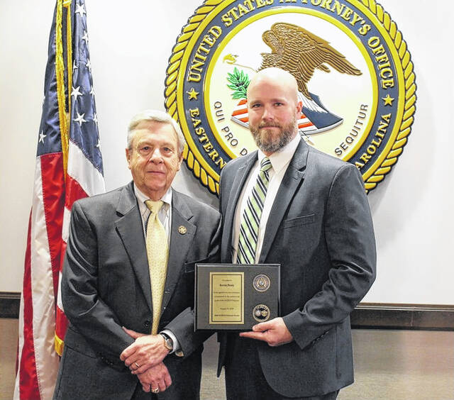 In 2020, Kevin Perry, right, received an award for his work in the Organized Crime Drug Enforcement Task Force. He is pictured with Sampson County Sheriff Jimmy Thornton.