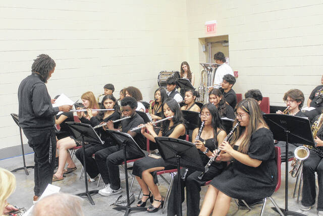 The Hobbton band practises Pomp and Circumstance before graduates begin filing into the Sampson County Agri-Exposition Center for graduation ceremonies.