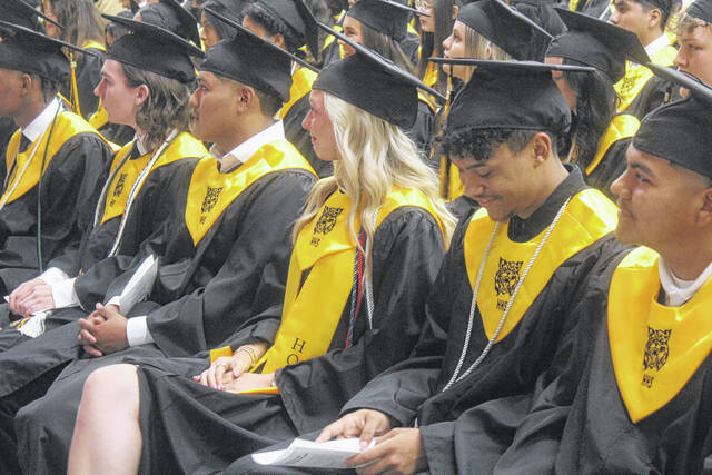 Members of the graduating class of Hobbton all are smiles as they listen during the valedictory address.