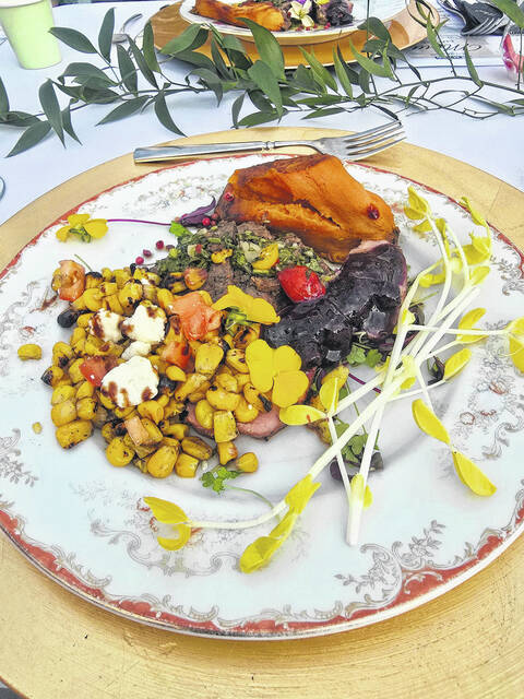 Roasted corn, prepared by Alfredos of Clinton, and a sweet potato cooked to perfection by staff from Newton Groves The Farm House accentuated a beautiful plate of beef and tenderloin, the entree for Sunday nights Dinner on Main guests. That was followed by a colorful Burneys of Clinton crossiant, filled with strawberries and blueberries. (Sherry Matthews|Sampson Independent)