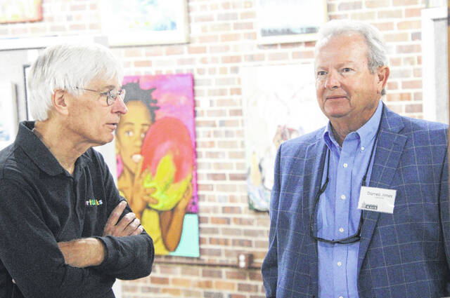 John Viser and Darrell Jones have a chat amongst the crowd gathered at ArtWorks.
                                 A. Goodman | Sampson Independent