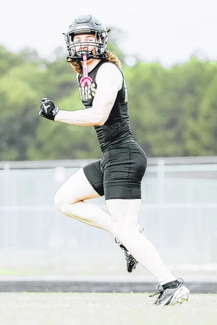Returning Clinton varsity receiver Bryson Mozingo looks back as he tracks an incoming ball.