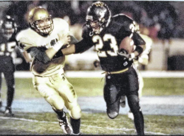 Leonard Henry, during his Dark Horse days, executes his signature stiff arm.