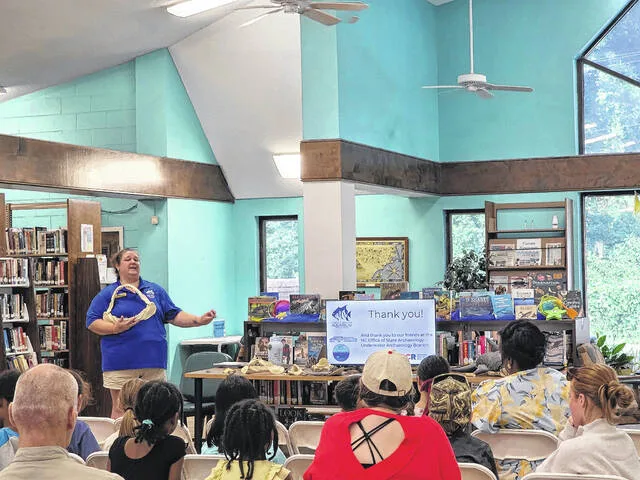 Kristin Holloman-Noe, Education Outreach Coordinator for the N.C Aquarium at Fort Fisher, gives a demonstration to students in attendance at one of the June Unearth a Story events.
                                 Courtesy Photo | Kelsey Edwards