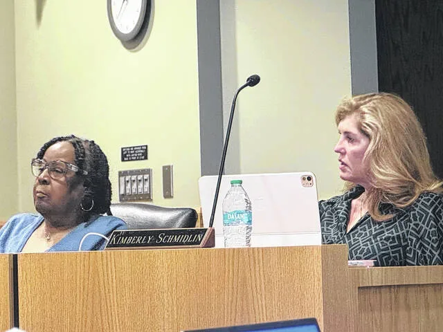 Outgoing county Board of Education members Sonya Powell and Kimberly Schmidlin react after being asked to vote on the Panorama platform for student data, almost immediately after being presented with it.