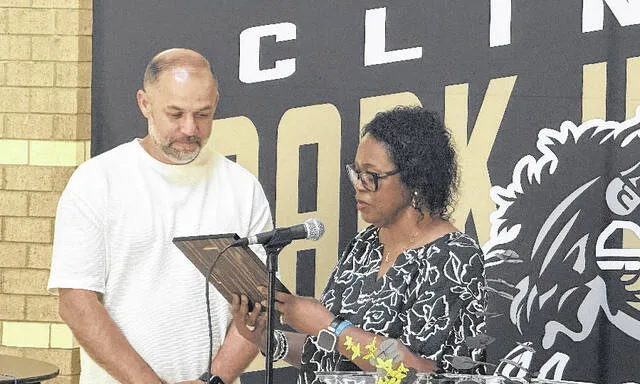 Former Clinton City Board of Education member Russ Emmanuel is honored with a plaque for his seven years of service on the board by chairwoman Dr. Linda Brunson.
Trevon McGlone | Sampson Independent