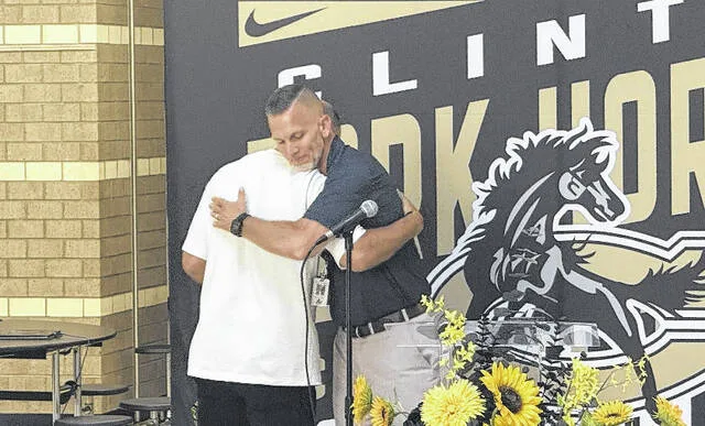 Clinton City Schools Superintendent Dr. Wesley Johnson shares an embrace with former Board of Education member Russ Emmanuel during Tuesdays reception.
Trevon McGlone | Sampson Independent