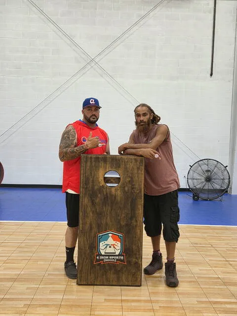 Clinton Recreation Department Cornhole Champions, Justin Carter a.k.a. Jaycee and Didier Lamb a.k.a. Harrells Wuu, pose for a photo after winning.
Courtesy photo | Justin Carter