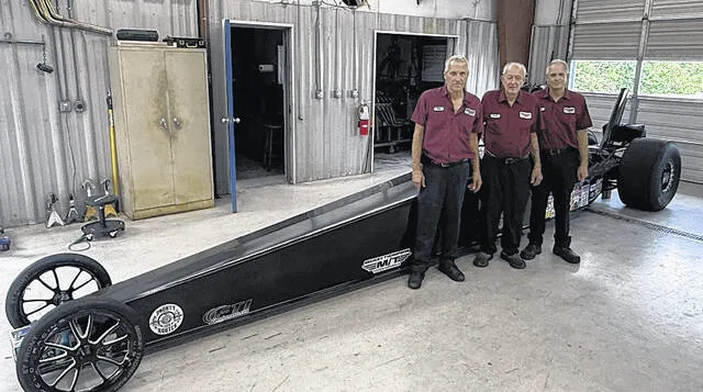 Clintons Bobby Warren stands with his two sons, Jeff and Joey, in front of his granddaughter Brookes car, which she races. The NHRA legend owns Warren Engines, where he works alongside both of his sons.
Trevon McGlone | Sampson Independent