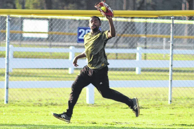 Splittin Gaps Jeffrey Jacobs makes a deep catch in the outfield in the middle of the fifth inning.
                                 Trevon McGlone | Sampson Independent