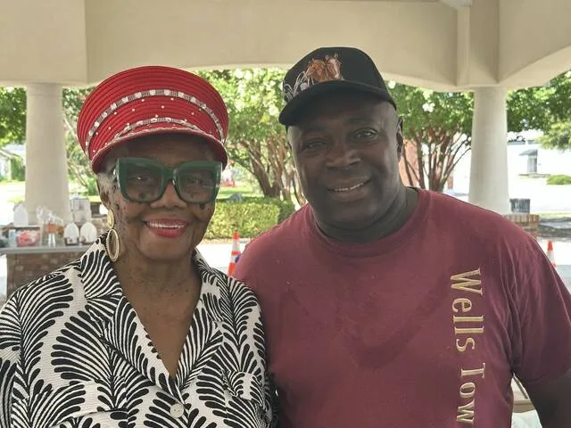 Community leader Patty Cherry poses for a photo with Rayford Wells who she thanked for helping place chairs and tables and doing other heavy lifting for the event.
Photos by A. Goodman | Sampson Independent