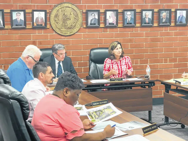 Roseboro Mayor Alice Butler addresses town board members about moving town funds into accounts at KS Bank, the new financial institution expected to come to Roseboro in the coming months.