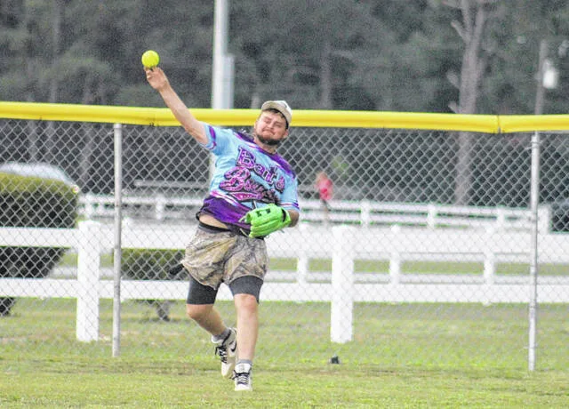 Bat and Boujees Payton Hope makes a throw from center field near the fence.
Trevon McGlone | Sampson Independent