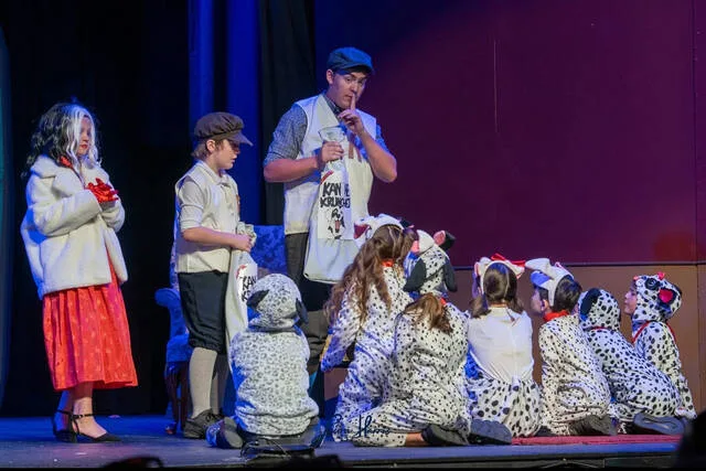 Cruella and her henchmen tempt the puppies with Kanine Krunches.
                                 Courtesy photo | Linda Jewell Carr