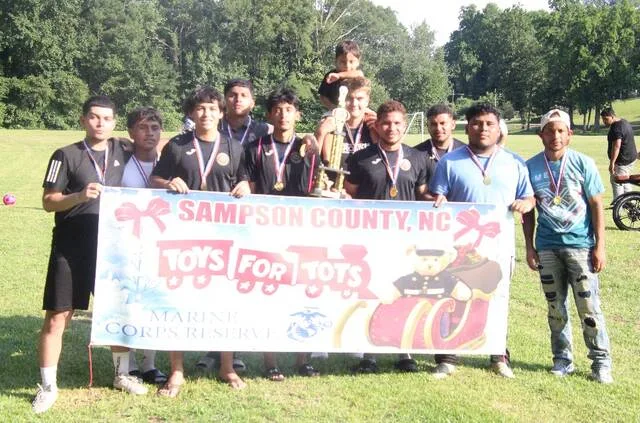 United FC celebrates their first place finish in the Grace Helping Others soccer tournament. The tournament was held Saturday and saw six teams compete for the top three finishes.
Trevon McGlone | Sampson Independent