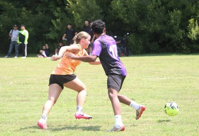 Clinton FCs Joel Lopez tries to hold off VIPs Larkin Best, as she tries to gain possession of the ball.
Trevon McGlone | Sampson Independent