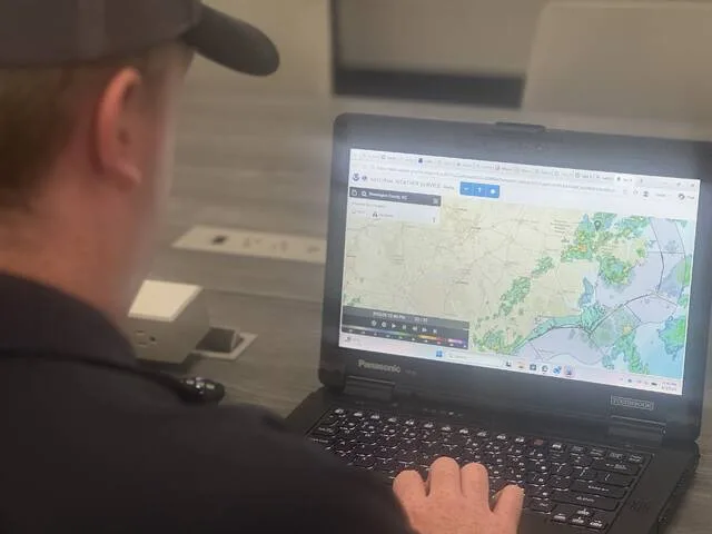 Dawson McLamb, the Emergency Management coordinator for Sampson County, looks over the storm radar at the weather headed towards Sampson County on Monday, Aug. 3. He says while there have been isolated storms, some straight-line winds, and some pretty nasty thunderstorms, no major incidents have occurred here so far this year.
                                 Dylan Atwood | Sampson Independent
