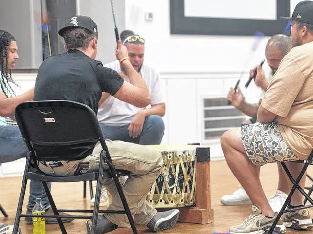 Smokey River Singers Kris Royal, Braycee Gibbs, Cory Brewington, Jordan Davis, and Cameron Price fill the Coharie Culture Center auditorium with the sounds of drumming and singing during a powwow etiquette class this past Thursday evening.
Dylan Atwood | Sampson Independent
