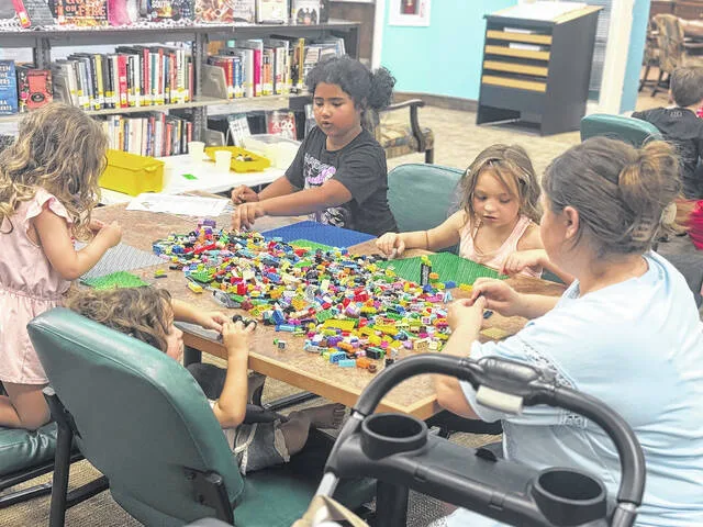 Jasper, Stormy, Elaina, and Virginia work away on their Lego challenges during the lab set up earlier this week.
                                 Dylan Atwood | Sampson Independent