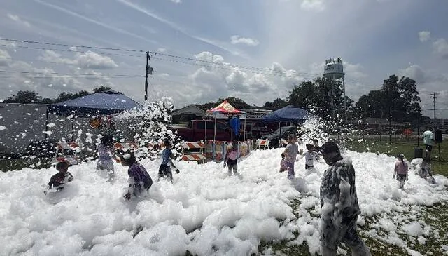 Lakewood District youngsters bounce around in a sea of foam Saturday during the first Lakewood Community Cookout held in Roseboro Park. The event, sponsored by the Community Schools initiative, offered food, as well as supplies, free backpacks and community resources for those in attendance.
Trevon McGlone | Sampson Independent
