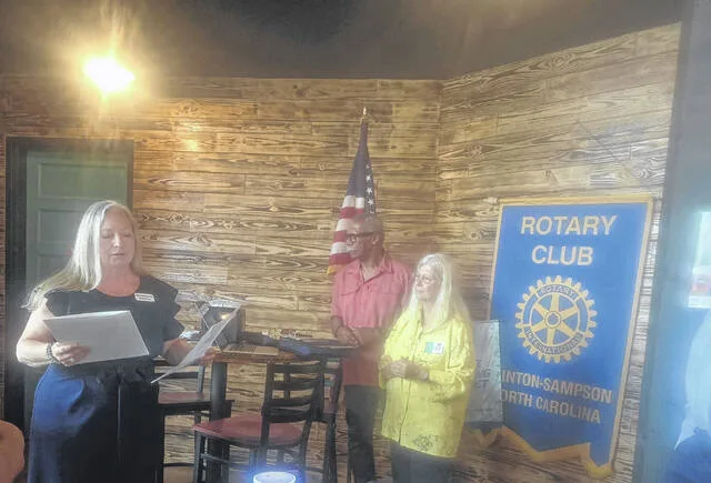Pamela Morris, assistant vice president and branch manager of Southern Bank in Clinton, receives a membership pin during the clubs regular Monday meeting and following her installation as the newest member of the Clinton-Sampson Rotary Club. Membership chairwoman Eileen Coite, standing in for sponsor club President-Elect Donna Jackson, places the pin. Pam High, Assistant Governor for Area 7 and District Paul Harris Society chairwoman, was on hand to conduct the installation. Afterward, Morris addressed club members, saying she was pleased to be a part of the club and believed strongly in serving the community.