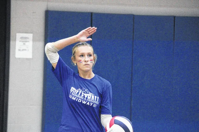 Senior Raider Maggie Phillips keeps her eyes down the court as she attempts to serve.
                                 Trevon McGlone | Sampson Independent