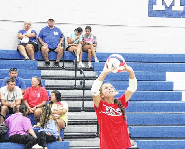 Midway freshman Preslie Williams sets the ball on offense for her team.
                                 Trevon McGlone | Sampson Independent