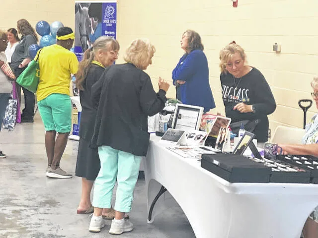 Optician Brenda Ledford explains all things glasses at the annual event Wednesday. Her mobile services come directly to seniors; they just need a glasses prescription.
Claire Fox | Sampson Independent