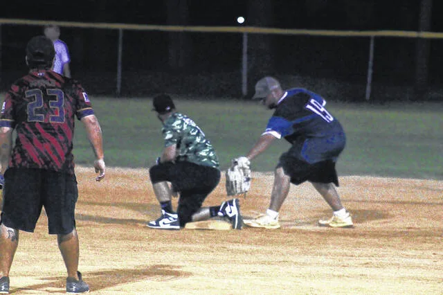Thrown Togethers Kevin Faircloth narrowly misses the tag to second during the fourth inning against Diamond Dynasty. Thrown Together got the win 27-24 to avoid elimination Thursday night.
Trevon McGlone | Sampson Independent