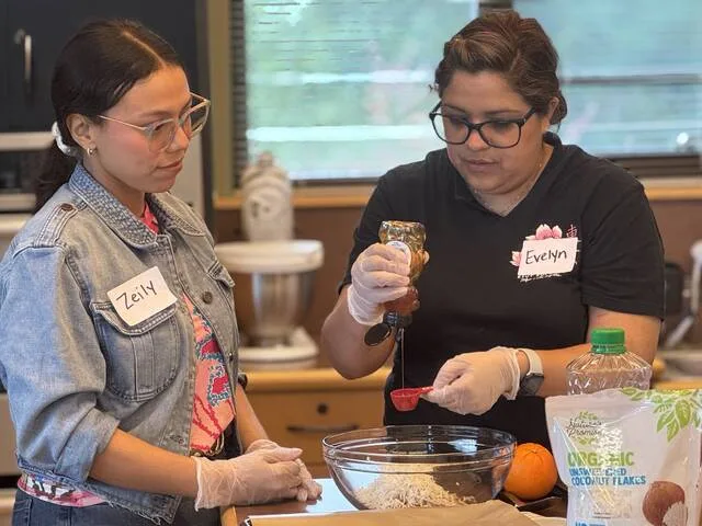 Zeily Araqz and Evelyn Cabanzo measure out honey at the dessert station during last weeks Mediterranean-style nutrition and cooking class.
Dylan Atwood | Sampson Independent