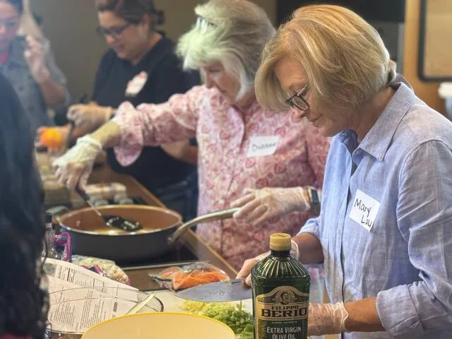 Mary Lou Rushing chops ingredients for a cucumber salad recipe during the cooking class.
Dylan Atwood | Sampson Independent