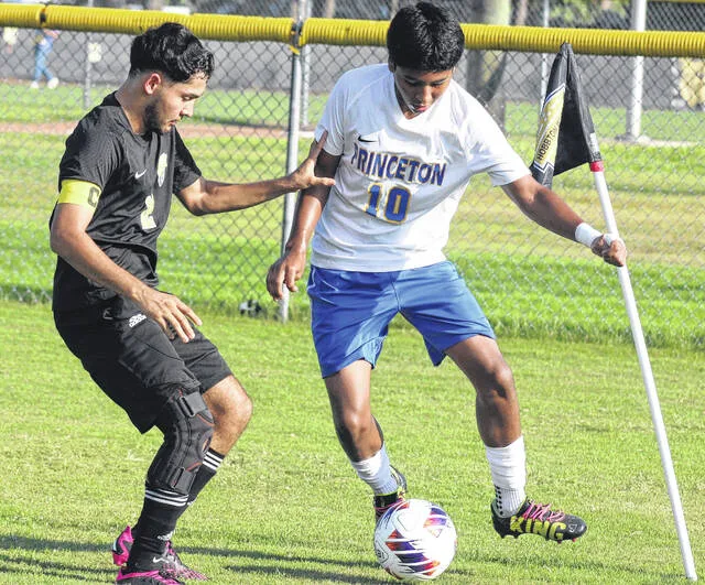 Hobbtons Anthony Diaz presses his Princeton opponent, Mateo Mayoral-Cisneros, toward the corner flag as he runs out of space. The Wildcats defeated the Bulldogs 3-1 Monday to secure their home opener with a win.
                                 Trevon McGlone | Sampson Independent