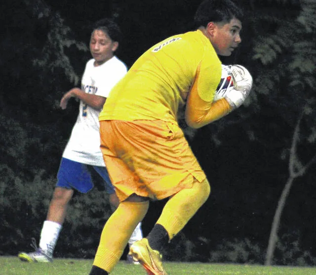 Hobbton goalkeeper Javier Escalera catches a shot from Princeton in the second half.
                                 Trevon McGlone | Sampson Independent