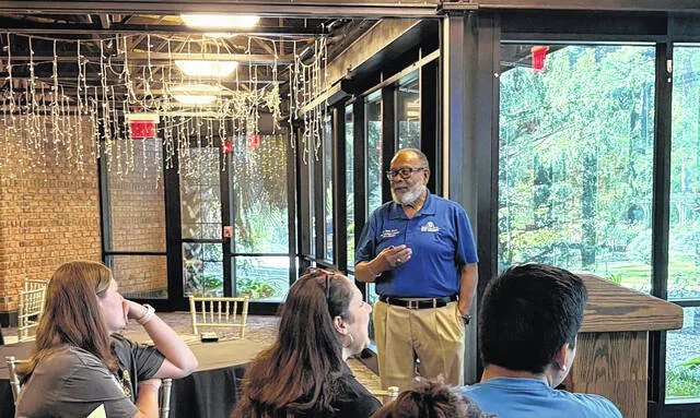 Dr. Paris Jones from Fayetteville State University leads the teachers through classroom management strategies at the Rooted in Success workshop at the Cape Fear Botanical Gardens