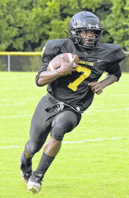 Hobbton running back Kevin Morrisey spots a hole in the defense as he runs for a decent gain.
                                 David Johnson | Sampson Independent