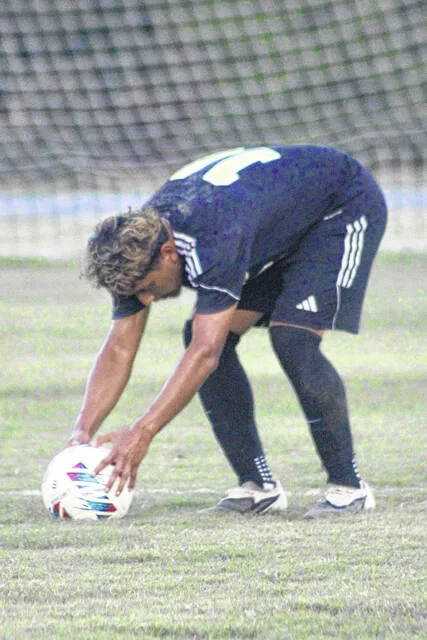 Sophomore Leopard Brandon Martinez places the ball down on the spot for a free kick.
                                 Courtesy Photos | Merari Acosta