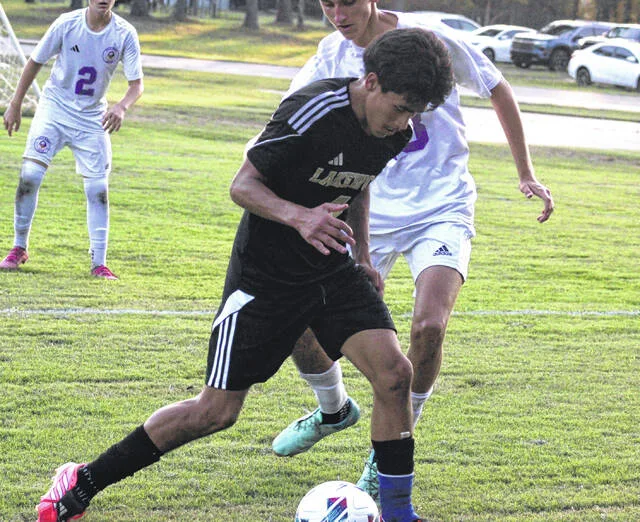 Lakewood junior defender Dublas Yanes moves forward in the attack as he gains possession of the ball.
                                 Trevon McGlone | Sampson Independent