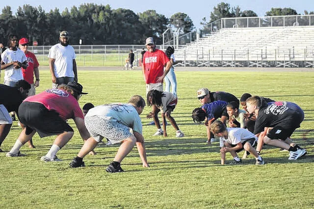 Participants at the Union football camp line up against each other to simulate the offensive and defensive linemen drills.
                                 Courtesy Photo | Sampson Parks and Recreation