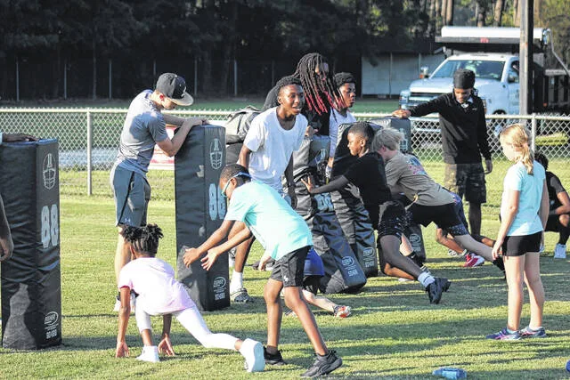 Lakewood camp kids attack the lineman dummies, as they practice their block techniques.
                                 Courtesy Photo | Sampson Parks and Recreation