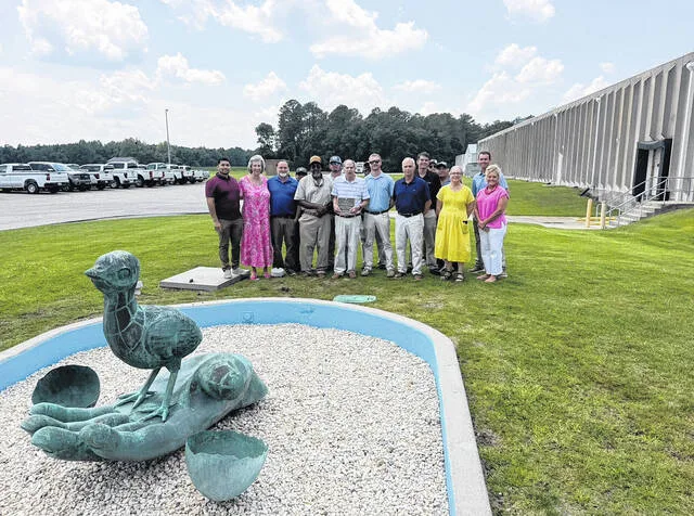 Gordon Campbell poses with others at the Prestage Farms hatchery in July when Campbell was honored for his 43 years of work with Prestage Farms and service to the hatchery and turkey breeder departments.
Courtesy photo | Prestage Farms, Inc.