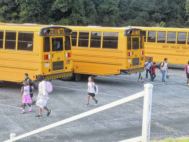 Kindergarteners and first graders arrive for the first day at Hargrove Elementary School on Aug. 17. Like Clinton City, the county school system is seeing a drop in enrollment.
                                 Dylan Atwood | Sampson Independent