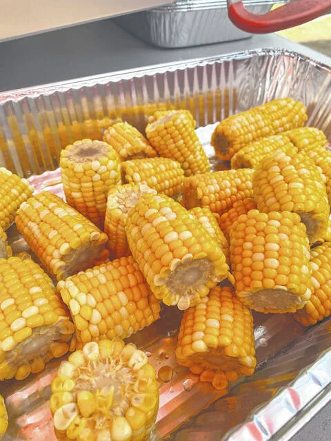 Tim Walters, the Low Country Boils head chef, prepares corn at a preview testing a couple of weeks ago.
                                 Courtesy photo | Tyler Wise