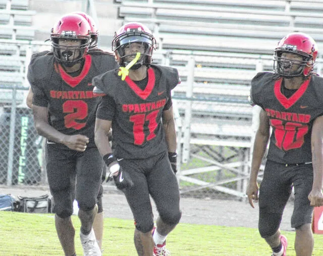 Union Highs Kamari Maynor and Kenny Bailey celebrate with defensive back Jayden Murphy, after Murphy makes an interception early on in the first quarter.
Trevon McGlone | Sampson Independent