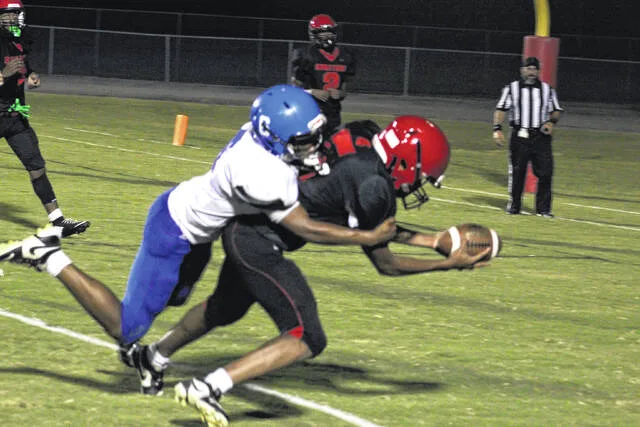 Union Highs Marquavion Melvin catches a pass and extends for the goal line on the two-point conversion late in the second half against Bear Grass Charter on Thursday evening. The Spartans won their home opener 46-22.
Trevon McGlone | Sampson Independent