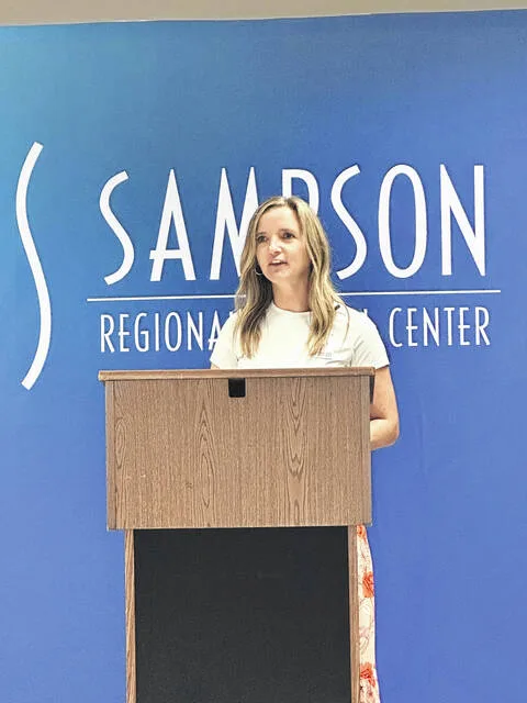 Morgan Shaw, director of Business Development at Sampson Regional, opens Thursdays ceremony ending the hospitals 75th anniversary year with remarks recapping events of the past year.