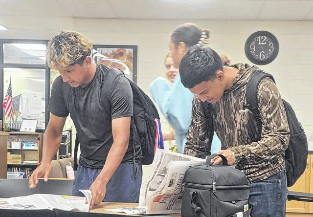 The Lakewood District Literacy Project kicked into high gear last week as the first Sampson Independent newspapers were placed into the hands of students at Lakewood High School, Roseboro-Salemburg Middle and Roseboro and Salemburg elementary schools. Here, Lakewood students Irving Martinez, Kamren Williams and Brandon Martinez enjoy time between bells reading the local news about their community, sports and schools. It was a great day, noted Literacy Project coordinator Carla Sutton.